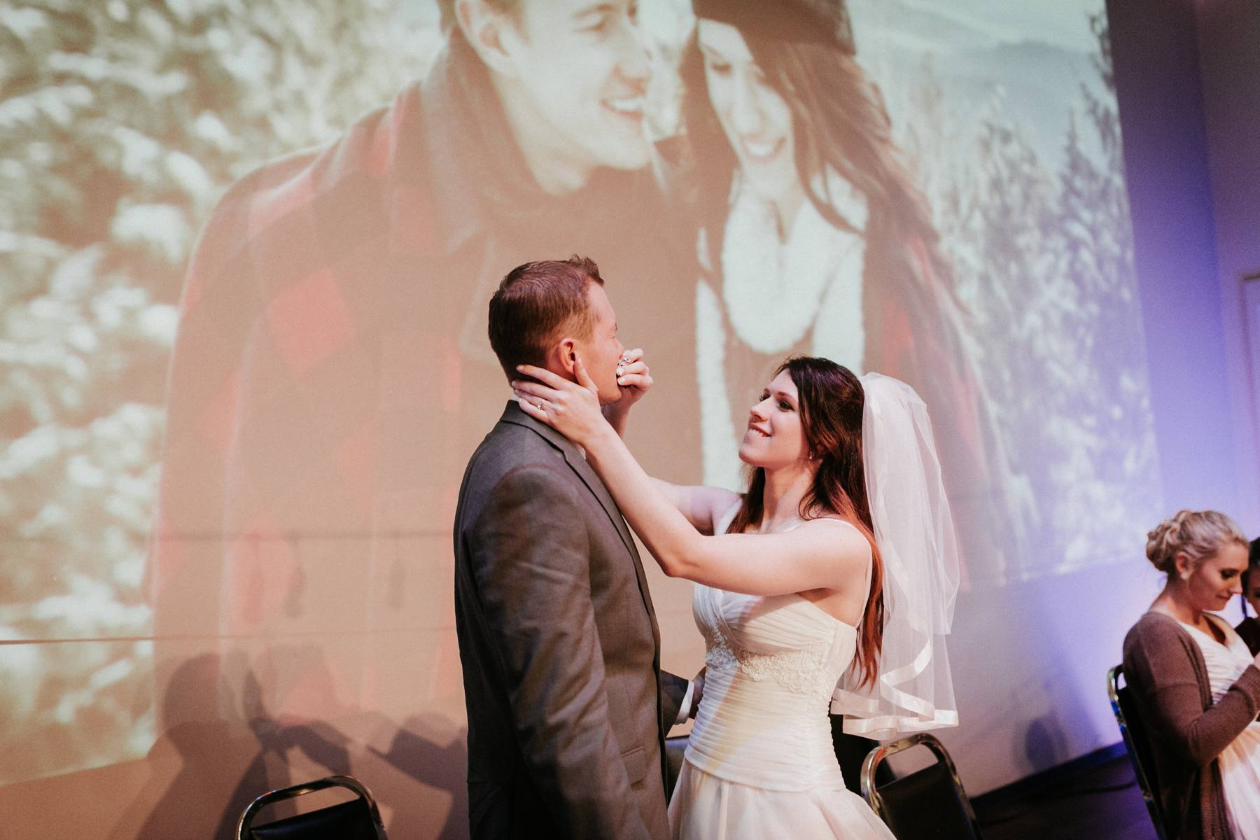 A couple in front of a projected photo